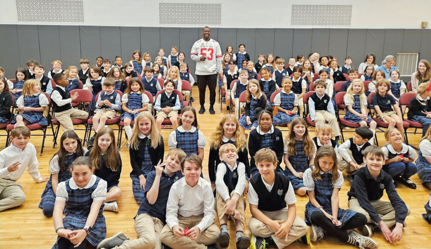A Youniversal Learning speaker with a full class of students after a school assembly