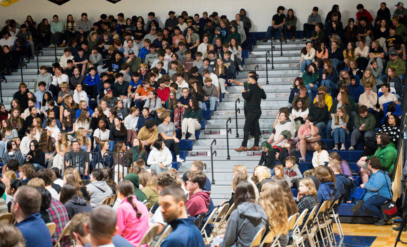 A Youniversal Learning assembly in a packed school gym