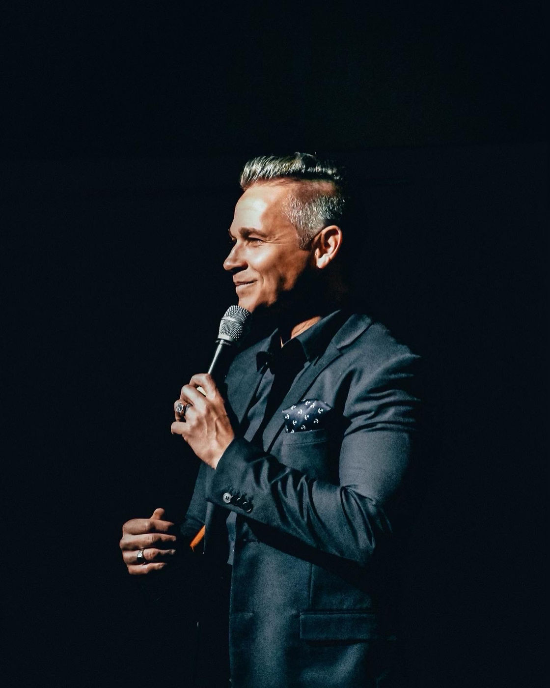 A Youniversal Learning speaker on stage addressing students